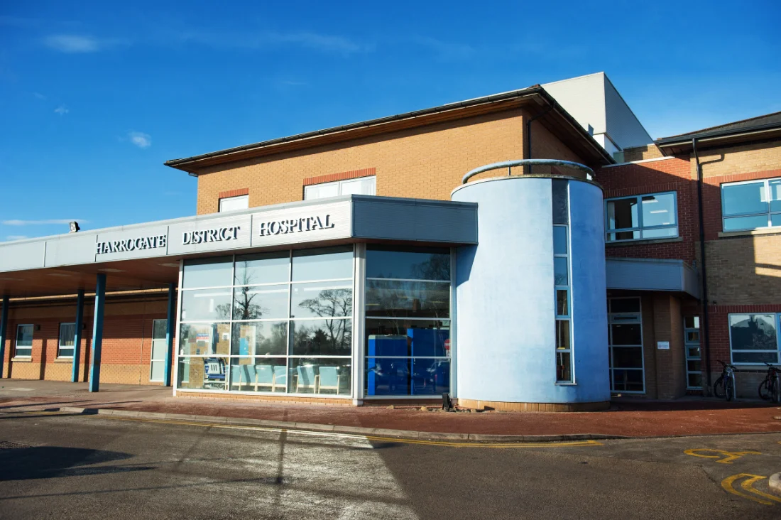The main entrance of Harrogate District Hospital on a clear day